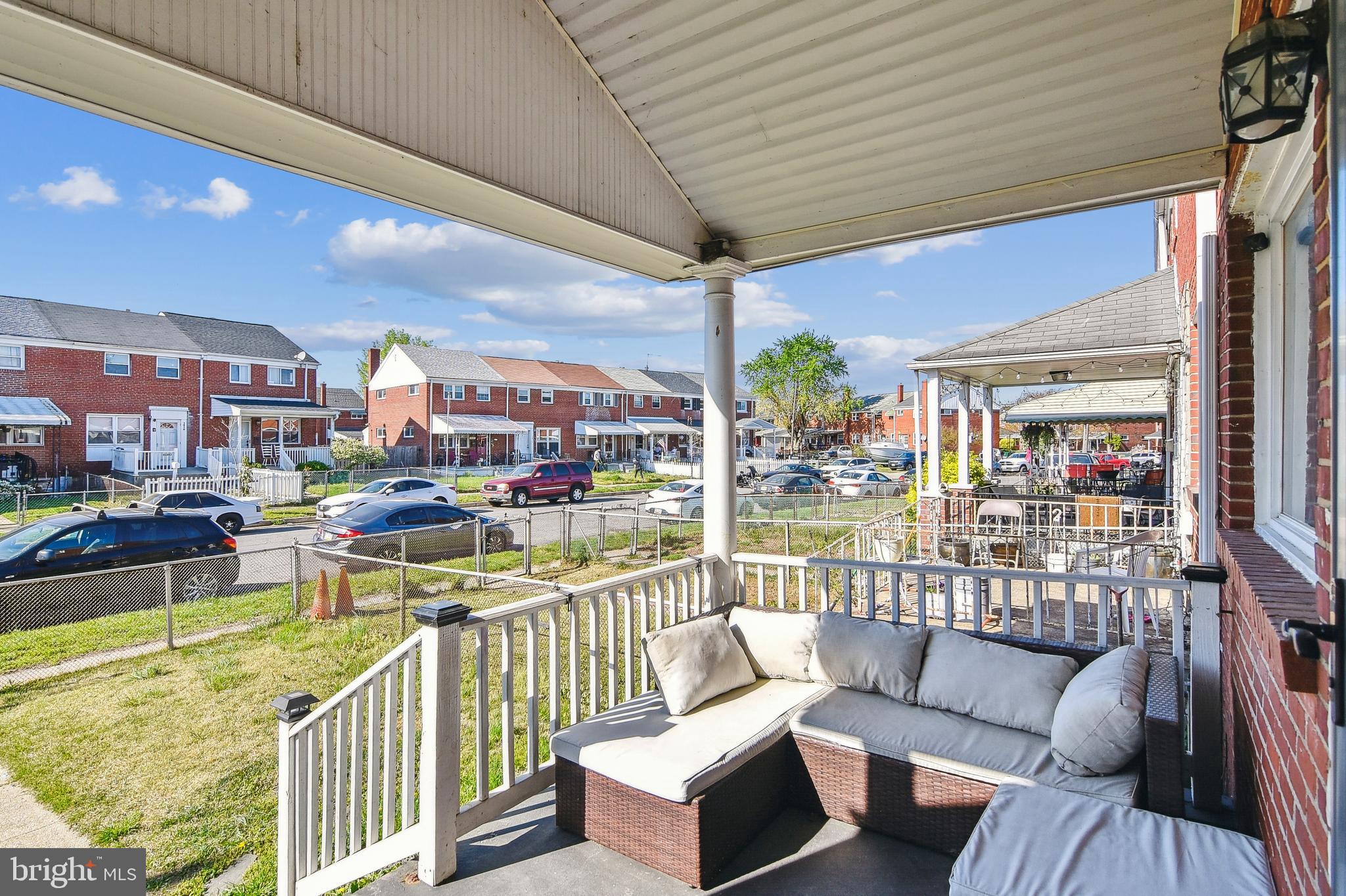 1921 Inverton Road Dundalk, MD 21222 - Photo 5 of 36 a balcony with furniture and a table