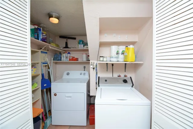 a utility room with dryer and washer