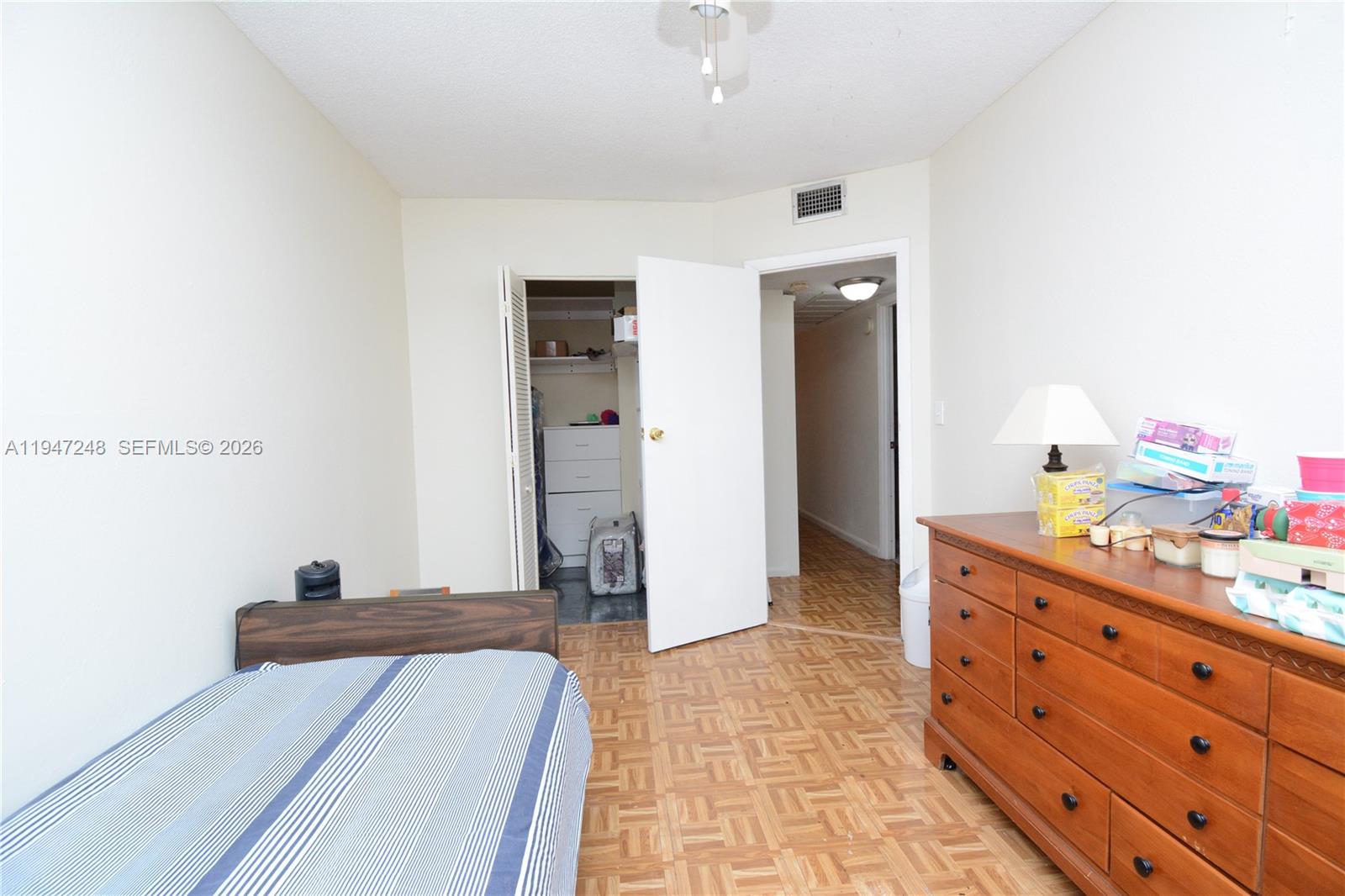 13935 Southwest 84th Street, Unit 905 Miami, FL 33183 - Photo 24 of 33 a room with a bed and a dresser