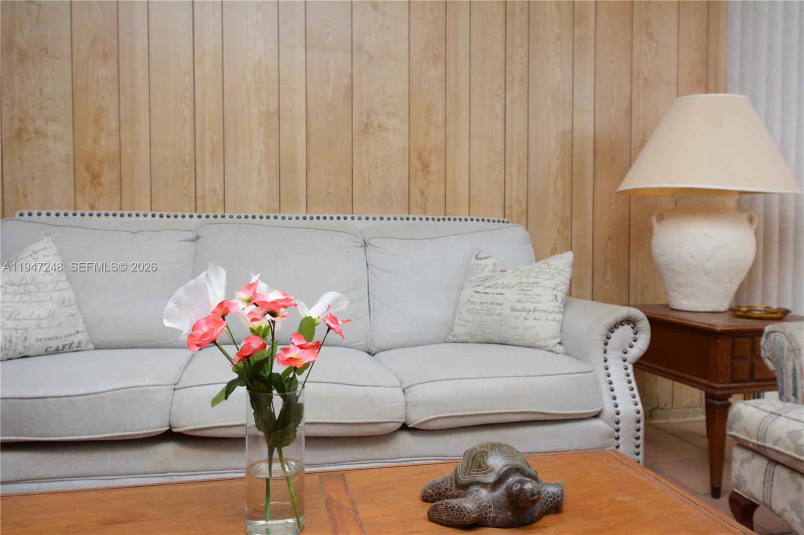 13935 Southwest 84th Street, Unit 905 Miami, FL 33183 - Photo 4 of 33 a living room with furniture and a potted plant