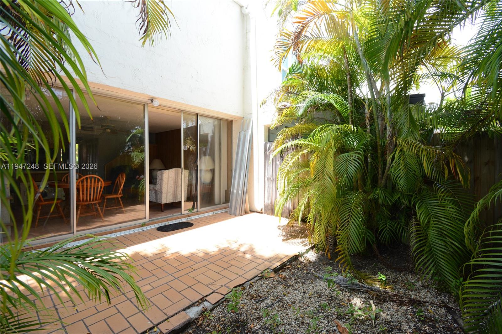 13935 Southwest 84th Street, Unit 905 Miami, FL 33183 - Photo 6 of 33 a view of backyard with patio