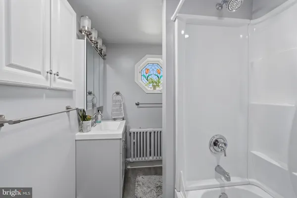a bathroom with a sink a toilet and a bathtub