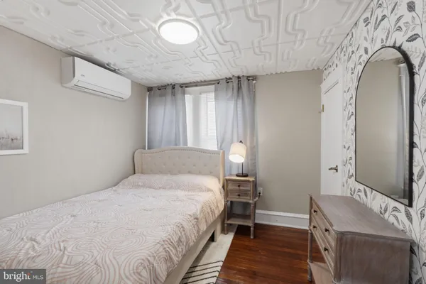 a bedroom with a bed and a table in it