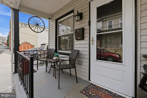 a view of entryway with wooden floor
