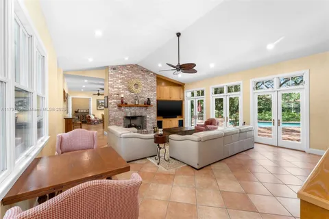 a bedroom with furniture and a wooden floor