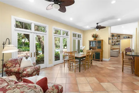 a spacious bedroom with a bed and wooden floor