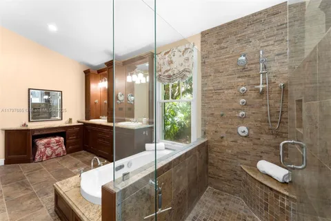 a spacious bedroom with a bed and a large window