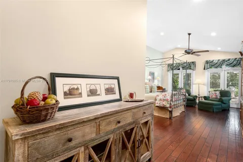 a bathroom with a granite countertop sink toilet a mirror and shower