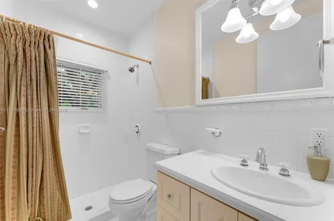 a view of a house with backyard porch and sitting area