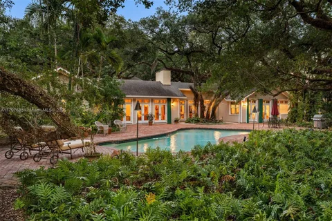 a front view of house with yard outdoor seating and green space