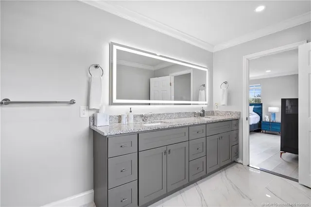 a bathroom with a granite countertop sink mirror and double