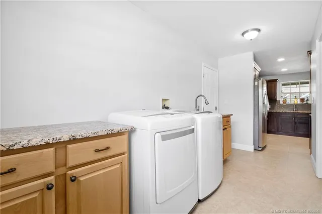 a view of a house with a garden and yard