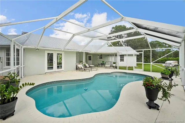 a view of a patio with a dining table and chairs