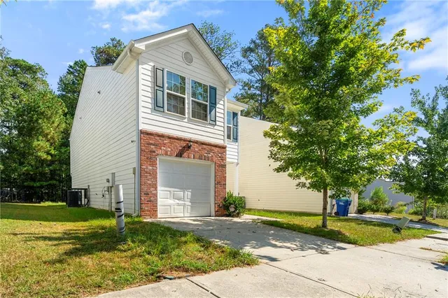 a front view of a house with garden