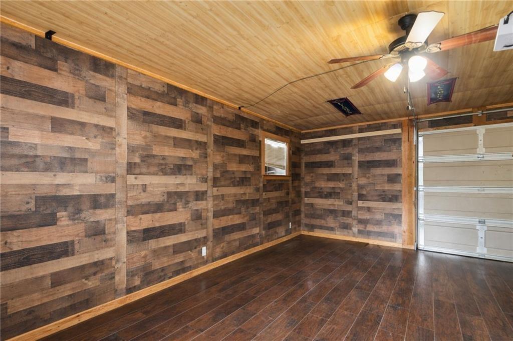 1344 Brookhaven Lane Blue Ridge, GA 30513 - Photo 14 of 17 a empty room with wooden floor and windows