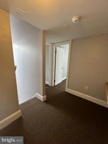 a view of an empty room and closet