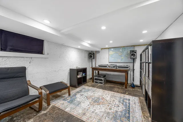 a view of a wooden fence under a large tree