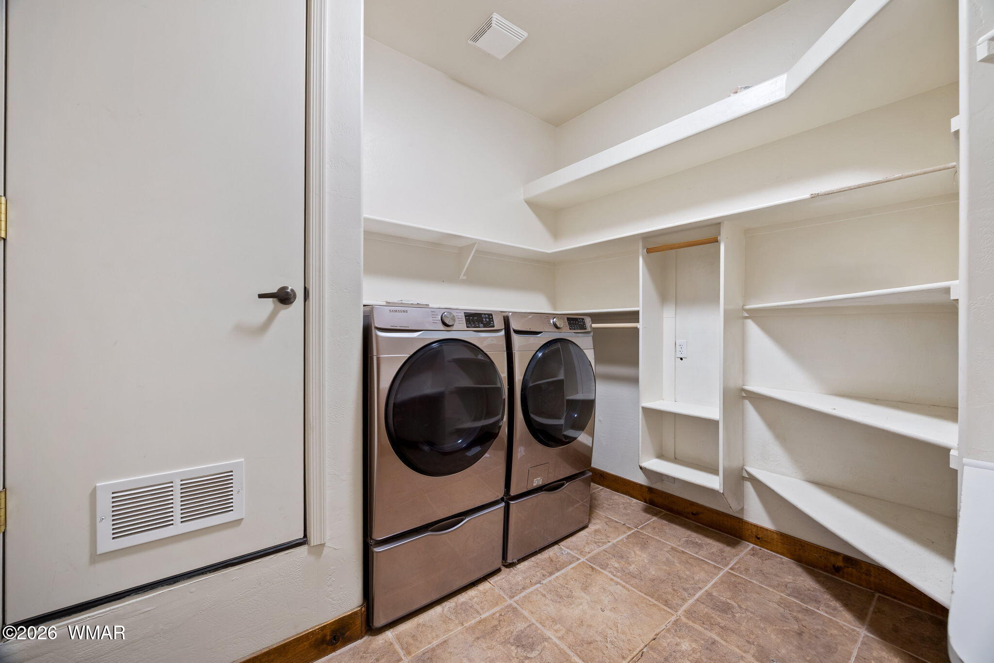1955 Ricochet Ranch Road Overgaard, AZ 85933 - Photo 14 of 48 a utility room with washing machine