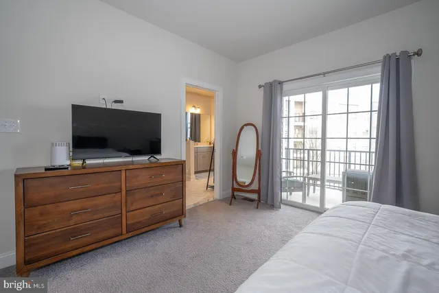 a room with furniture and flat screen tv