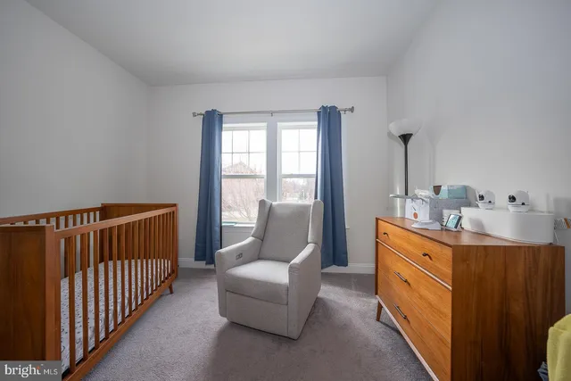 a living room with furniture and windows