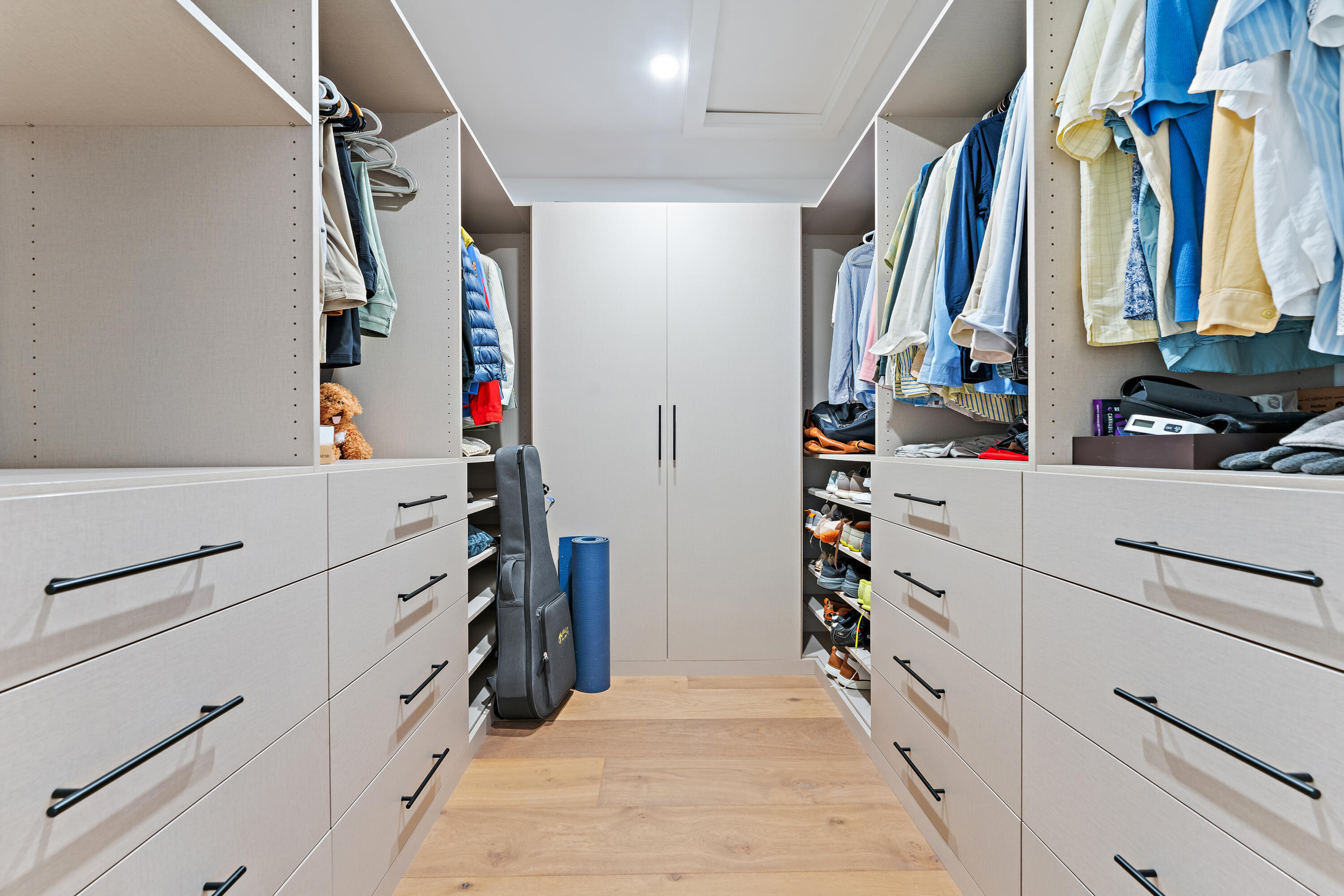 116 South Sewalls Point Road Sewall's Point, FL 34996 - Photo 32 of 92 a view of walk in closet with clothes and shoes