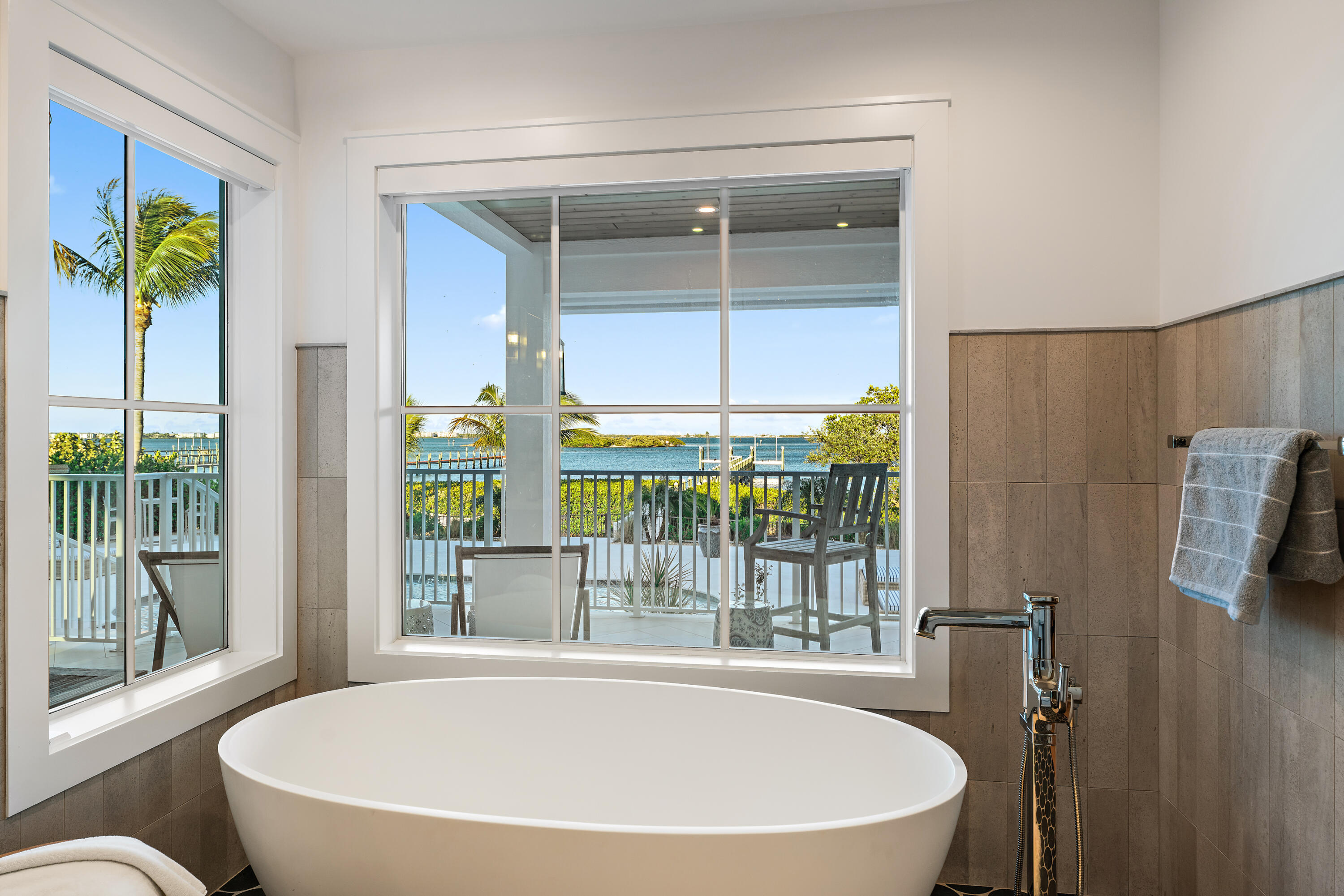 116 South Sewalls Point Road Sewall's Point, FL 34996 - Photo 35 of 92 a white bath tub sitting in front of a window