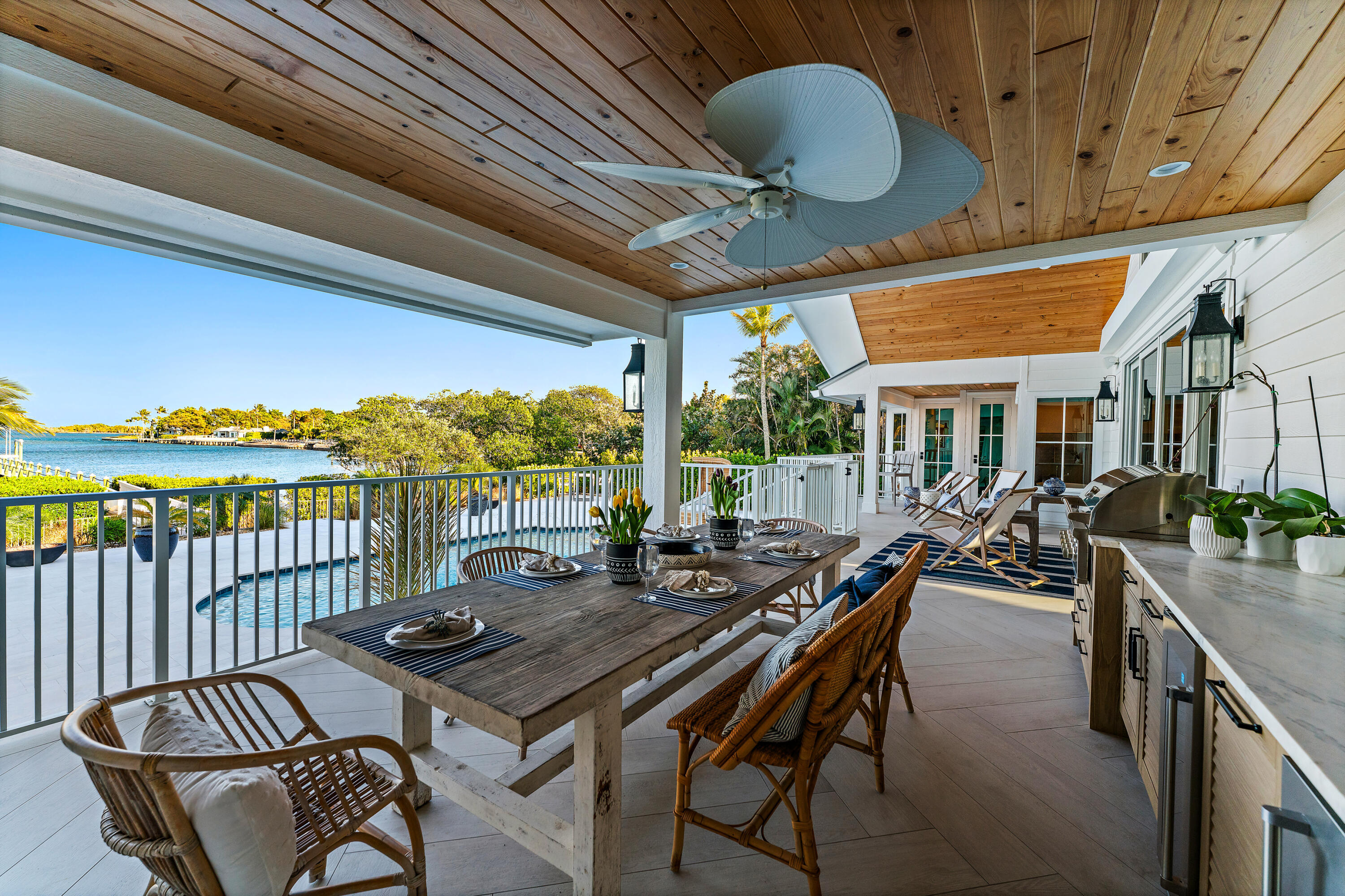116 South Sewalls Point Road Sewall's Point, FL 34996 - Photo 60 of 92 a view of a patio with a dining table and chairs