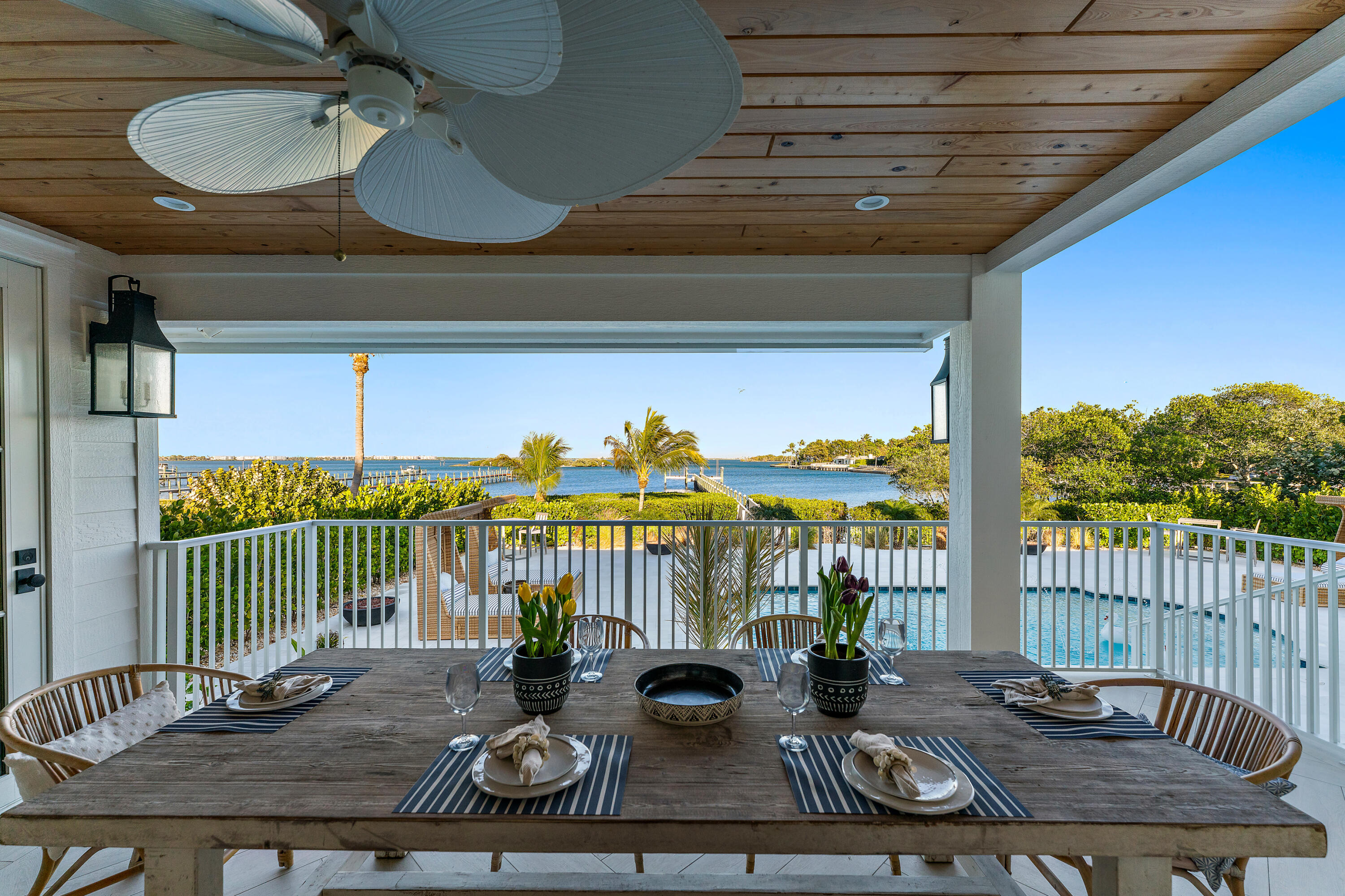 116 South Sewalls Point Road Sewall's Point, FL 34996 - Photo 61 of 92 a view of a balcony with furniture and floor to ceiling window