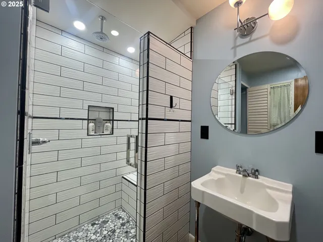 a front view of house with yard and trees in the background