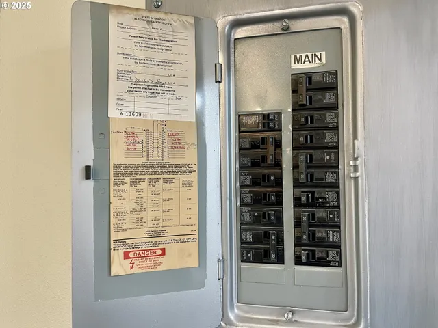 a kitchen with a sink a refrigerator and cabinets