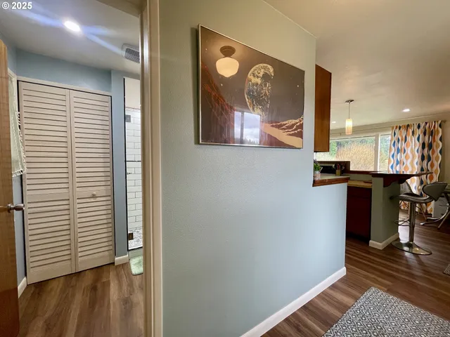 a view of an entryway with wooden floor