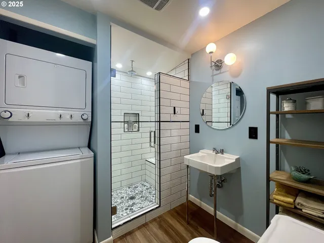a bathroom with a toilet a sink and mirror