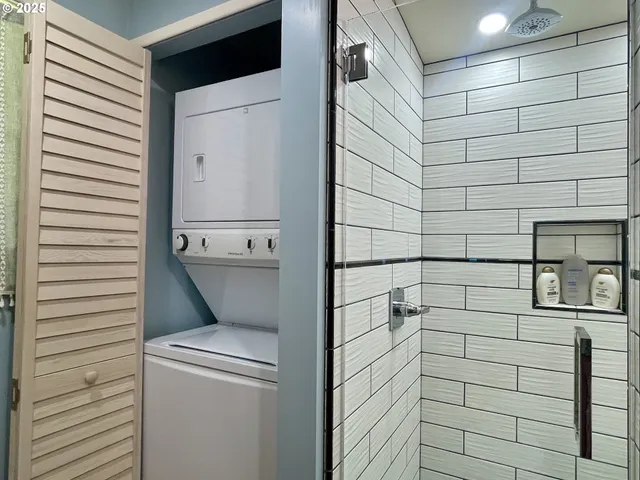 a bathroom with a sink a mirror and shower