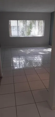 a stove top oven sitting inside of a kitchen