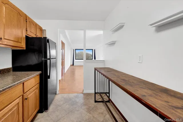 a kitchen with stainless steel appliances a refrigerator and a stove