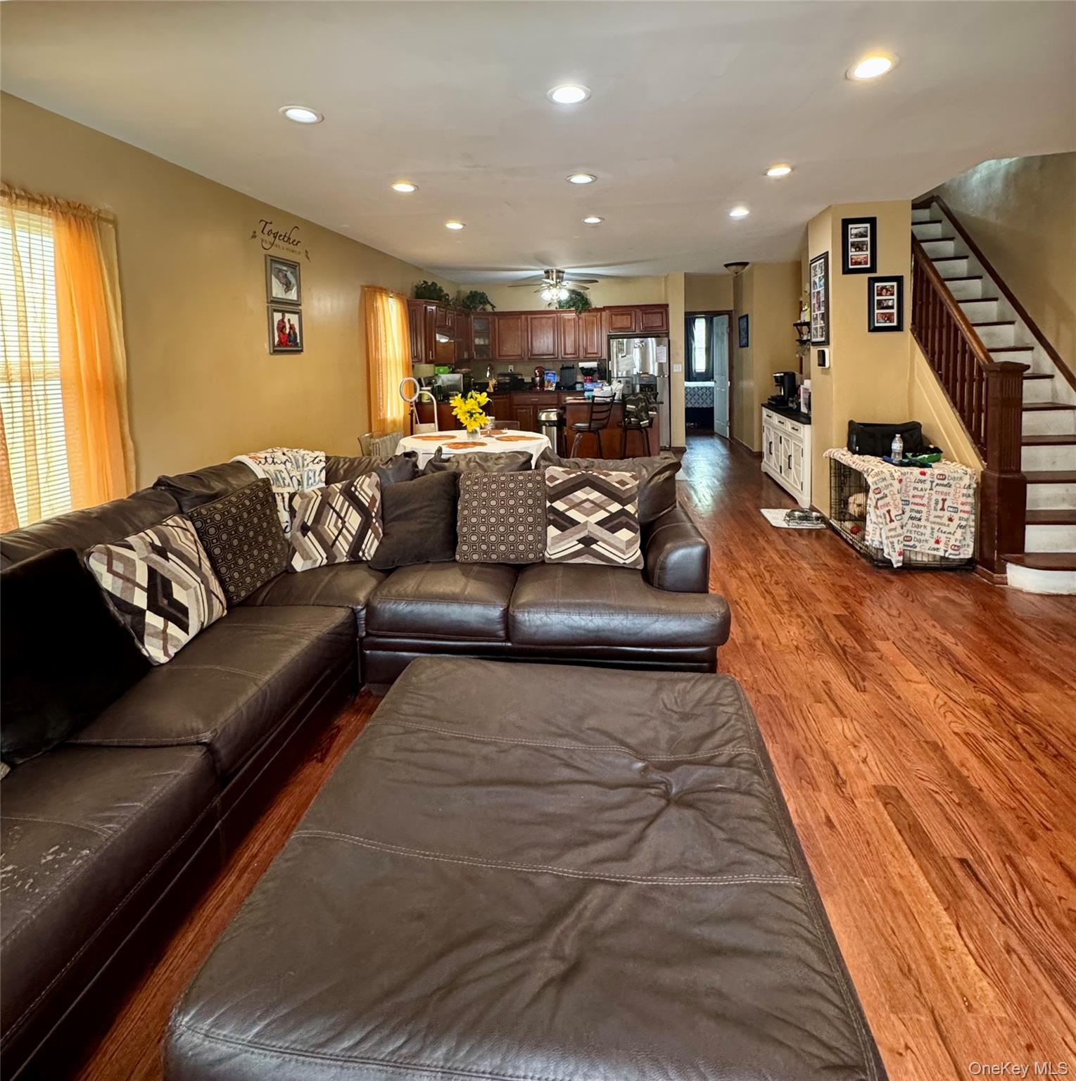 188-25 Mangin Avenue Queens, NY 11412 - Photo 2 of 10 Living area featuring wood finished floors, ceiling fan, recessed lighting, and stairway