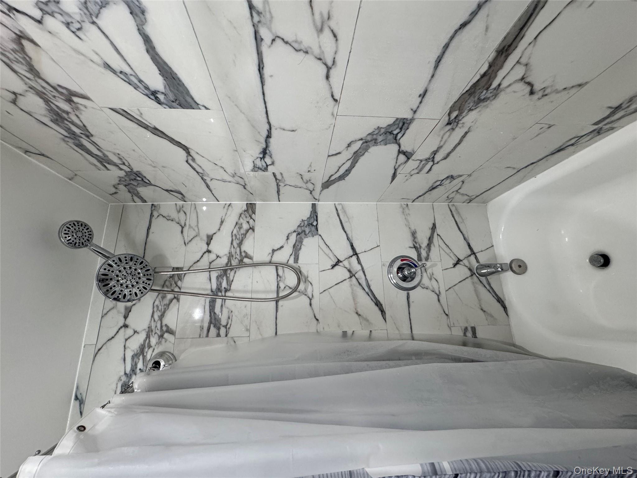 188-25 Mangin Avenue Queens, NY 11412 - Photo 6 of 10 Full bathroom featuring shower / tub combo with curtain