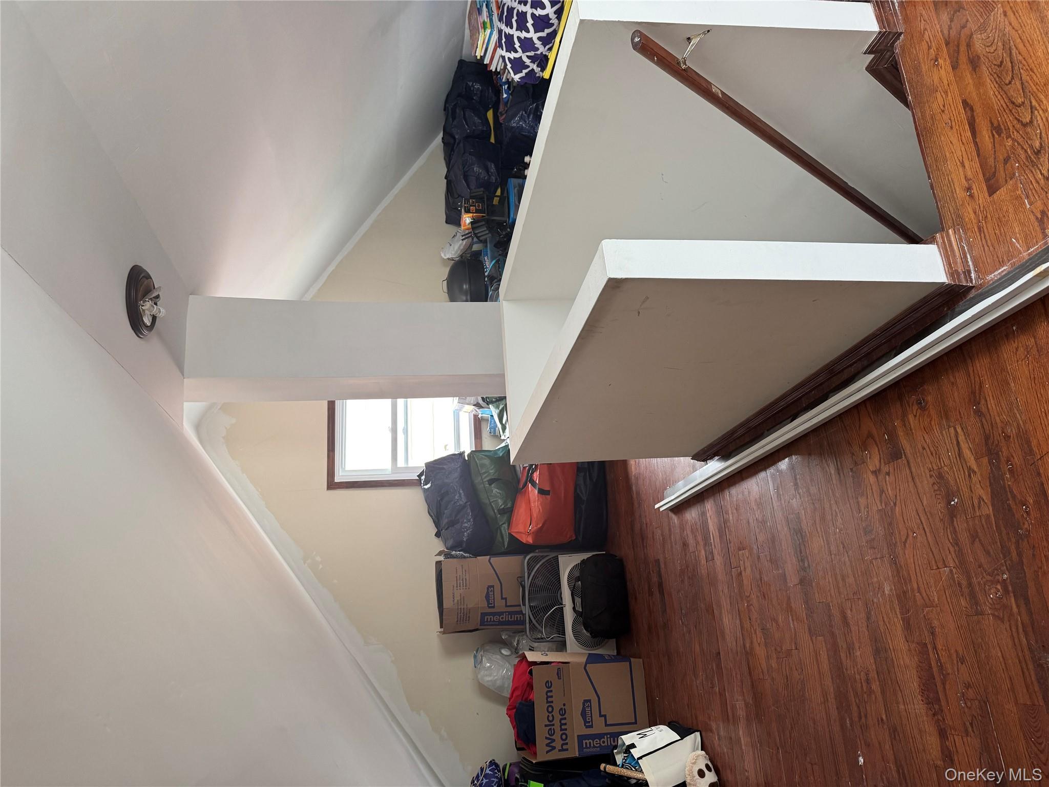 188-25 Mangin Avenue Queens, NY 11412 - Photo 10 of 10 Additional living space with wood finished floors and lofted ceiling