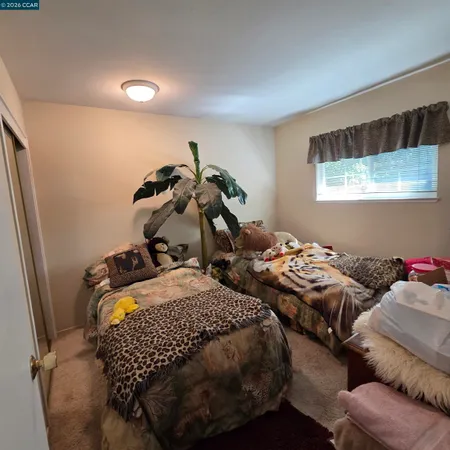 a bed room with two bed and a couch