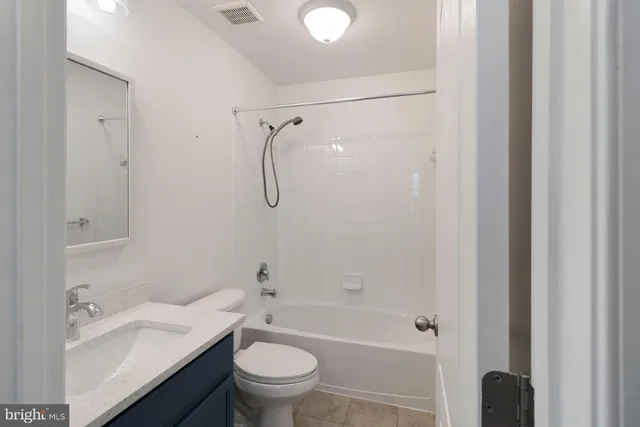 a view of a house with swimming pool and sitting area