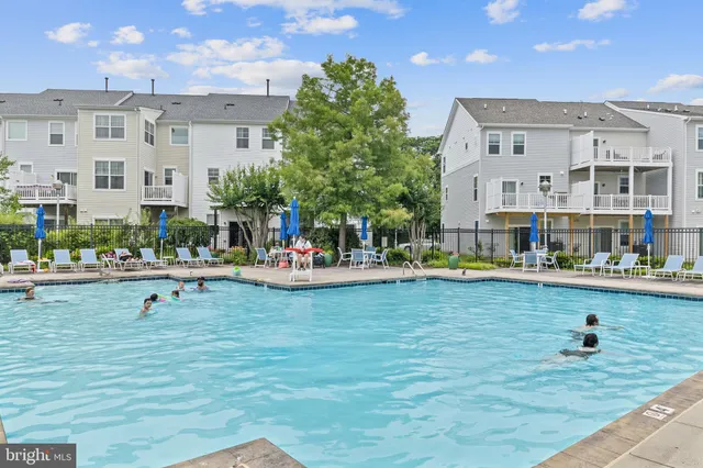 a view of a swimming pool with a lounge chairs