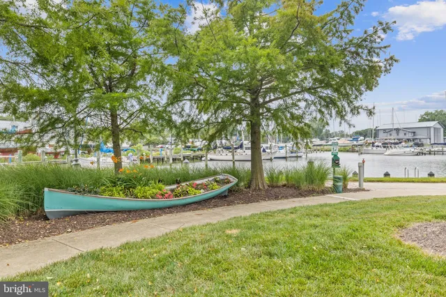 an aerial view of residential house with outdoor space and lake view