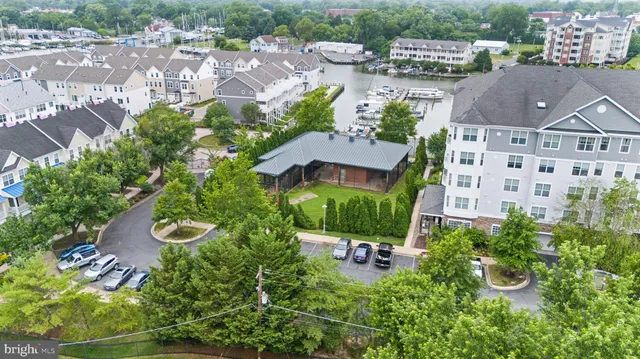 a view of water with boats and trees in the background