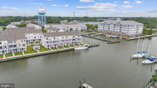 a front view of a building with a tree