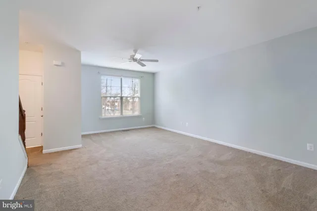 a kitchen with stainless steel appliances granite countertop a refrigerator a sink and a stove