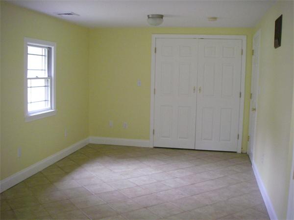 105 Slab Bridge Road Freetown, MA 02702 - Photo 4 of 6 an empty room with windows