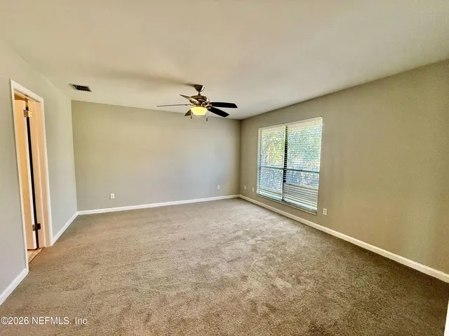 a bathroom with a tub sink and granite