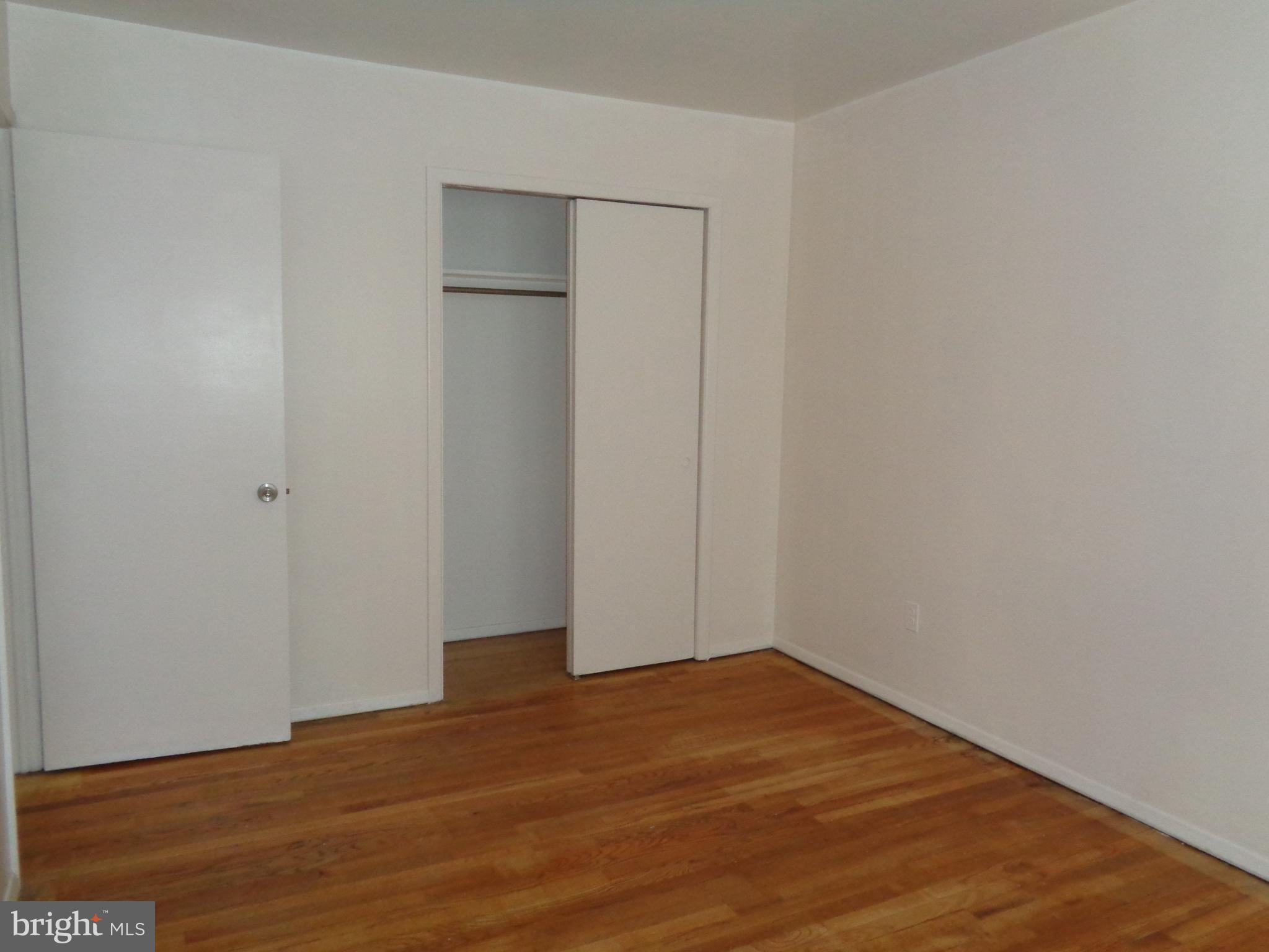 6213 Marlora Road Baltimore, MD 21239 - Photo 14 of 26 a view of empty room with wooden floor