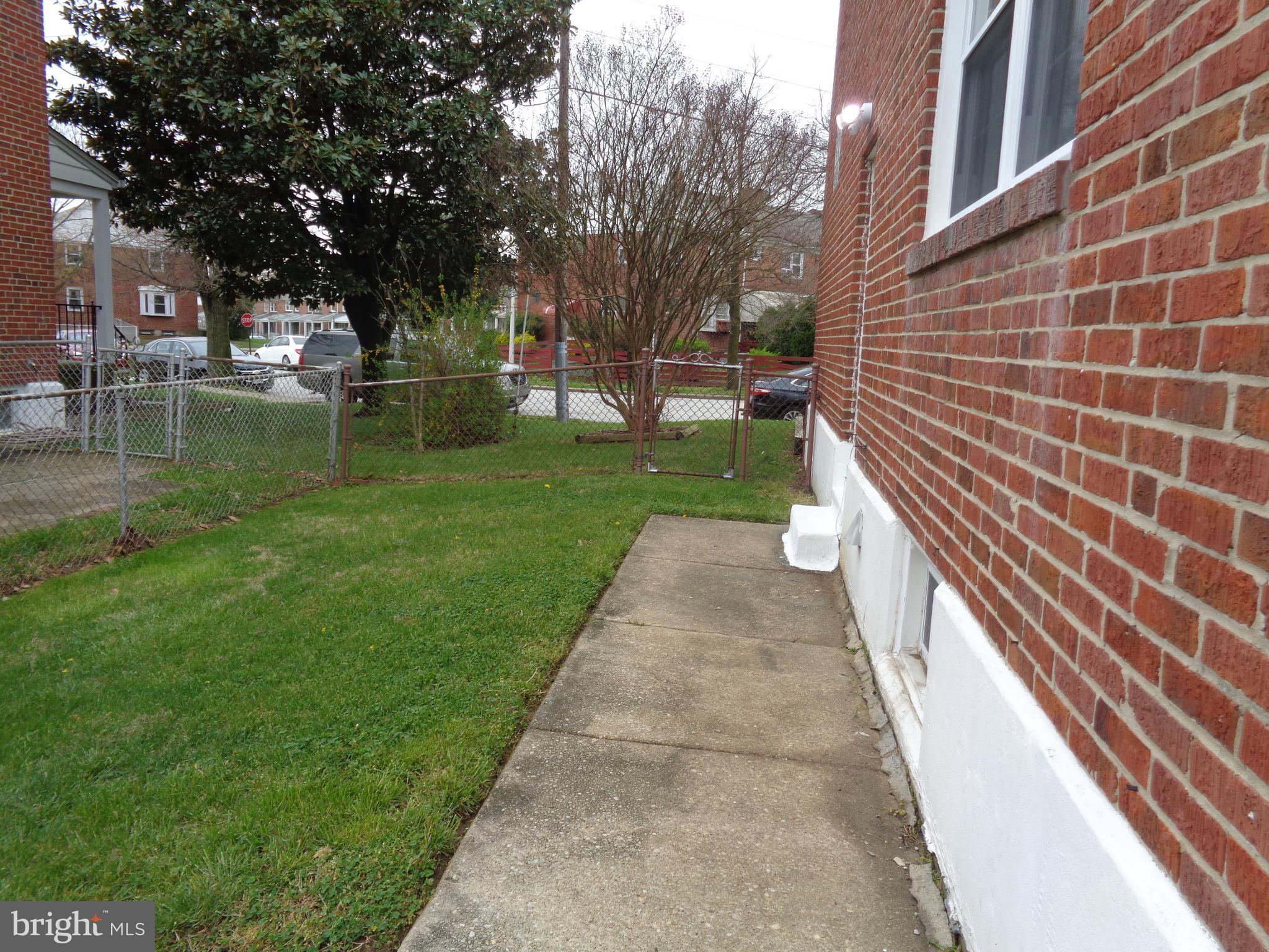 6213 Marlora Road Baltimore, MD 21239 - Photo 21 of 26 a view of a patio with a yard