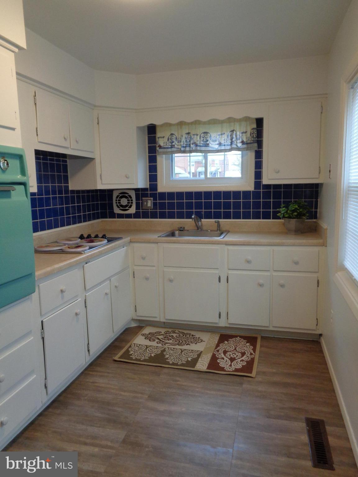 6213 Marlora Road Baltimore, MD 21239 - Photo 6 of 26 a view of a kitchen with sink and window